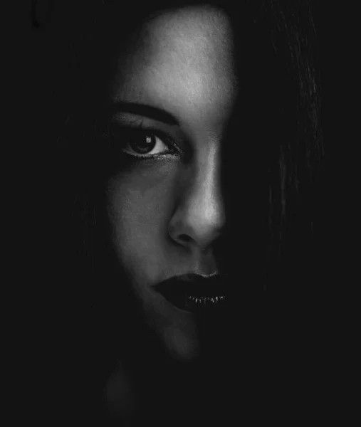 Dark and mysterious. Cropped dark portrait of a young womans face. — Stock Photo, Image