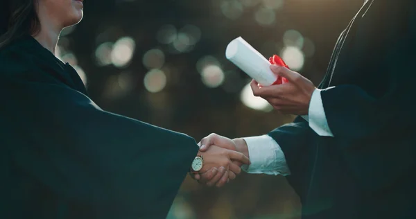 It took a lot of work and struggles to earn this diploma. Shot of a student receiving her diploma on graduation day. — Stock Photo, Image