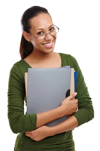 Preparado para aprender. Retrato de una atractiva joven estudiante sosteniendo unas carpetas en su pecho aisladas en blanco. — Foto de Stock