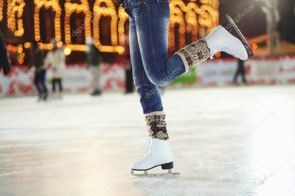 Grace on skates. Cropped shot of a young woman skating on an ice rink.