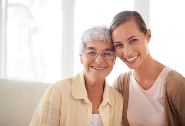 Shes my rock. Portrait of a smiling young woman and her senior mother bonding. Royalty Free Stock Images