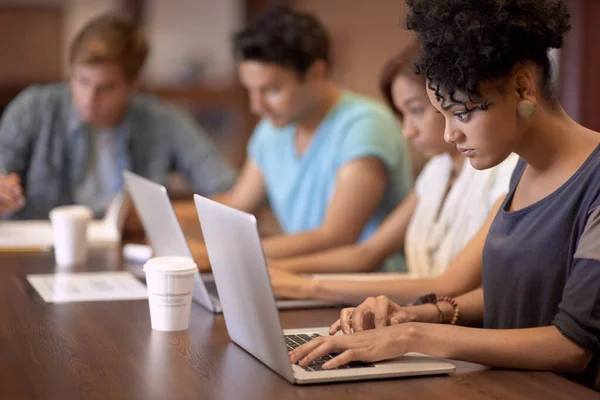 Theyve got a great study group. A group of students studying in the library. — Stock Photo, Image