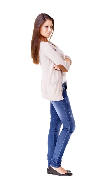 Keeping things casual. Studio show of a beautiful young woman standing with her arms folded against a white background. — Stock Photo, Image