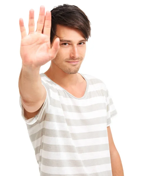 Give me five. Handsome trendy young man holding up his hand to the camera, isolated on white - copyspace. — Stock Photo, Image