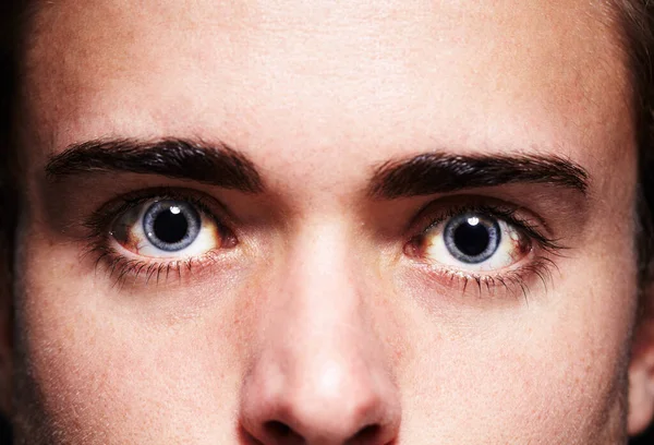 High as a kite. Closeup portrait of a young mans face with dilated pupils. — Stock Photo, Image