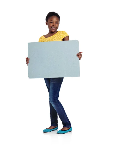 Growing into womanhood. Full length studio shot of an african teenage girl holding a blank board. — Stock Photo, Image