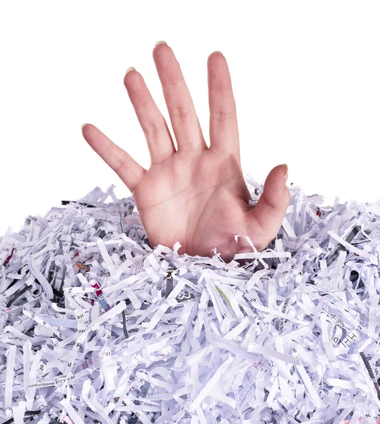 Drowning in destroyed documents. Studio shot of a womans hand reaching out from under a pile of shredded paper against a white background. — Stock Photo, Image