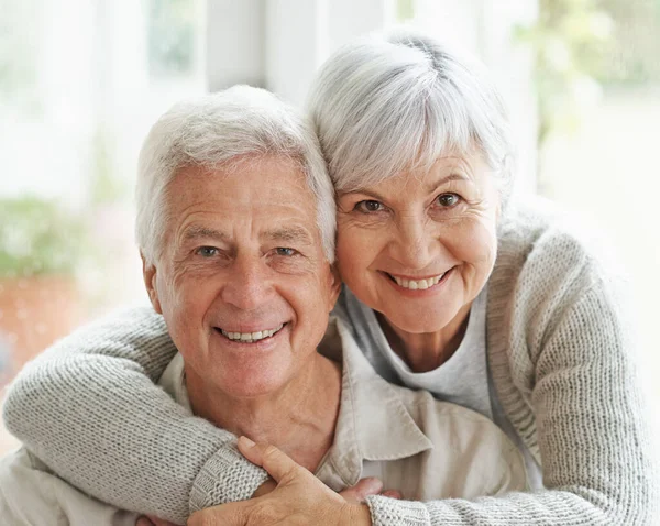 After all these years, Im still happy I chose him. A loving senior couple smiling at the camera. — Stock Photo, Image