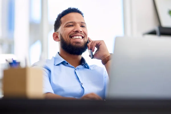 Building client rapport is the most important thing to me. Cropped shot of a handsome young businessman sitting alone in the office and using his cellphone during the day. — Stock Photo, Image