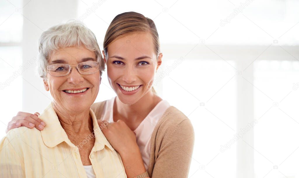 She means the world to me. Portrait of a smiling young woman and her senior mother bonding.