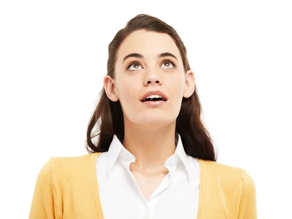 Wow Whats that up there. Young woman looking up against a white background. — Stock Photo, Image