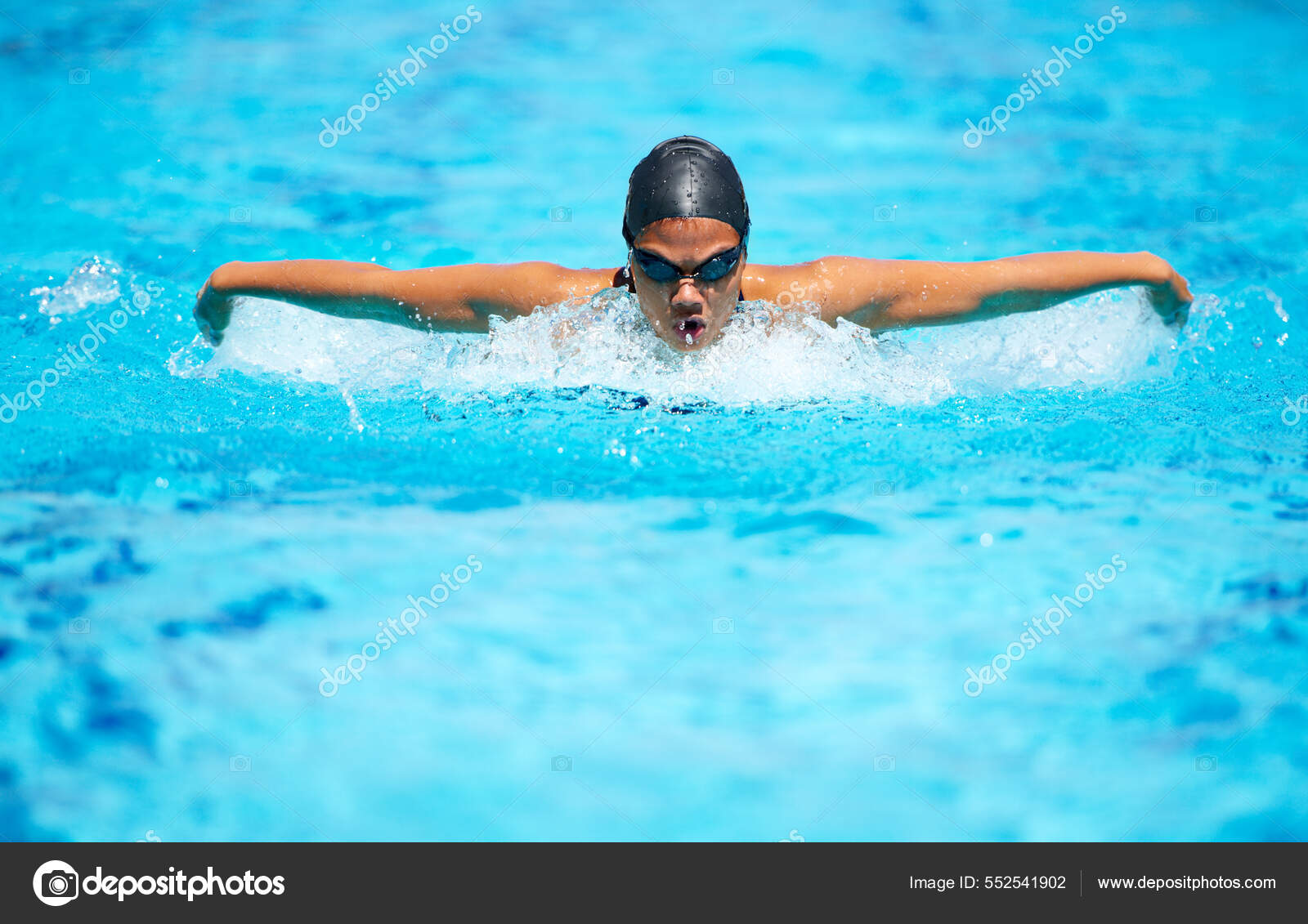 Bettering her time stroke by A focused young female