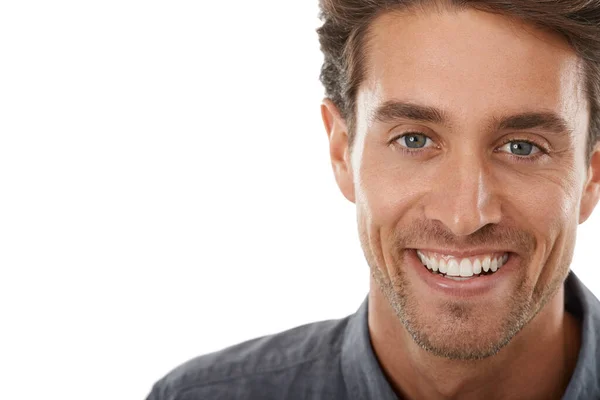 Hes so charismatic. Portrait of a handsome young man smiling against a white background. — Stock Photo, Image