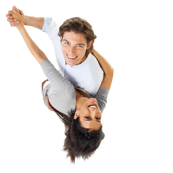 Ele faz-lhe girar a cabeça. Um casal multi-étnico dançando isolado em um fundo branco vista de alto ângulo. — Fotografia de Stock