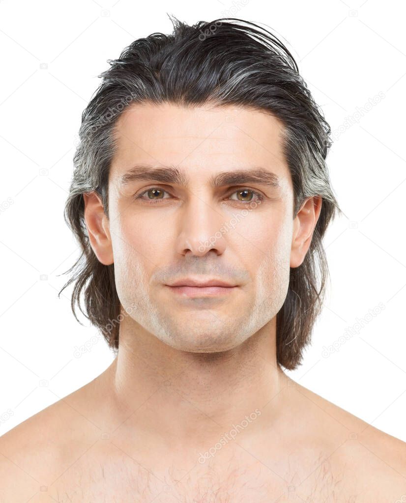 Hes one seriously good looking guy. Studio portrait of a handsome, shirtless man posing against a white background.