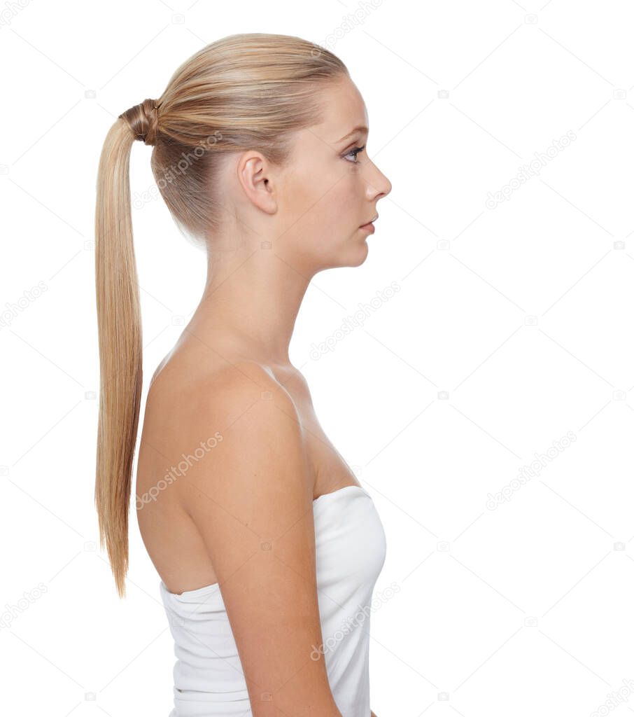 Showing the benefits of great beauty treatments. A beautiful blonde woman with a ponytail isolated against a white background.