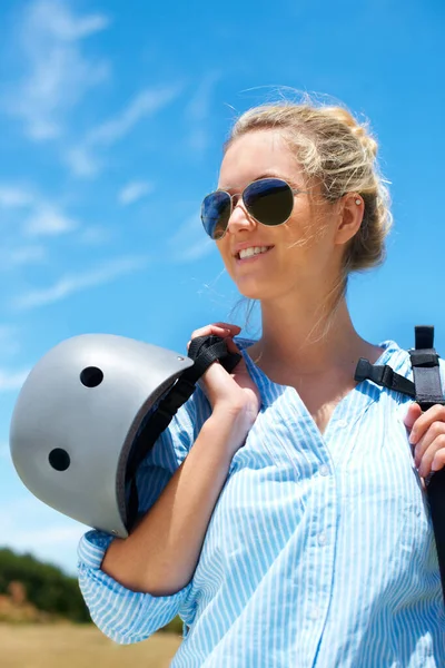 Ready for her next jump. Shot of a young woman about to go parachuting. — Stock Photo, Image