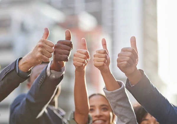 Our optimism is unbeatable. Shot of a group of businesspeople giving the thumbs up. — Stock Photo, Image