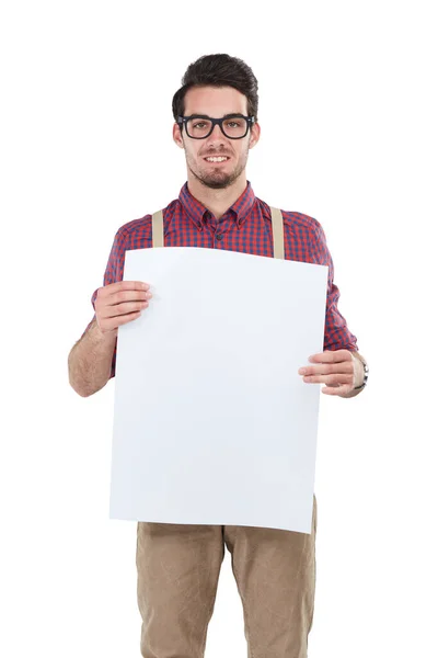 A vossa atenção, por favor. Estúdio de um jovem segurando um cartaz em branco contra um fundo branco. — Fotografia de Stock