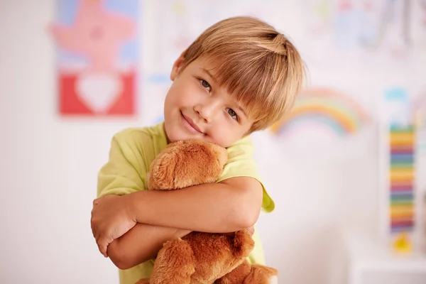 Childhood moments. Portrait of a cute little boy hugging his stuffed animal. — Stock Photo, Image