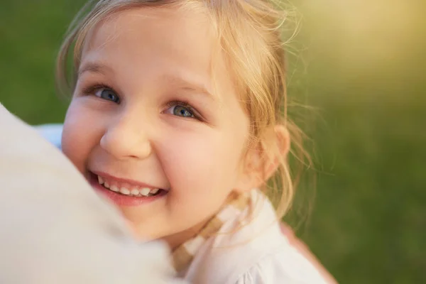 The joys of being a kid. Portrait of a cute little girl enjoying the day outside. — Stock Photo, Image