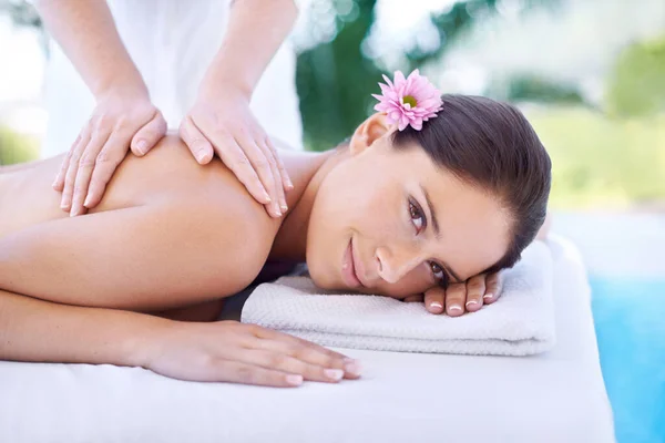 Feeling so pampered. Shot of an attractive young woman,getting a back massage at a spa. — Stock Photo, Image