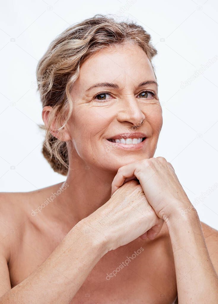 No one regrets a good skincare regime. Shot of a beautiful mature woman posing against a white background.
