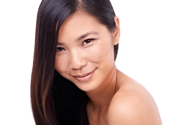 Charm and innocence. Cropped shot of a beautiful young oriental woman against a white background. — Stock Photo, Image