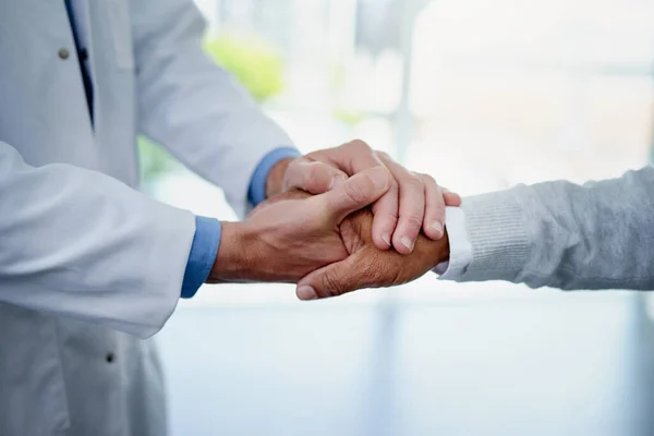 Theres always hope. Closeup shot of an unrecognizable doctor holding a patients hand in comfort. — Stock Photo, Image