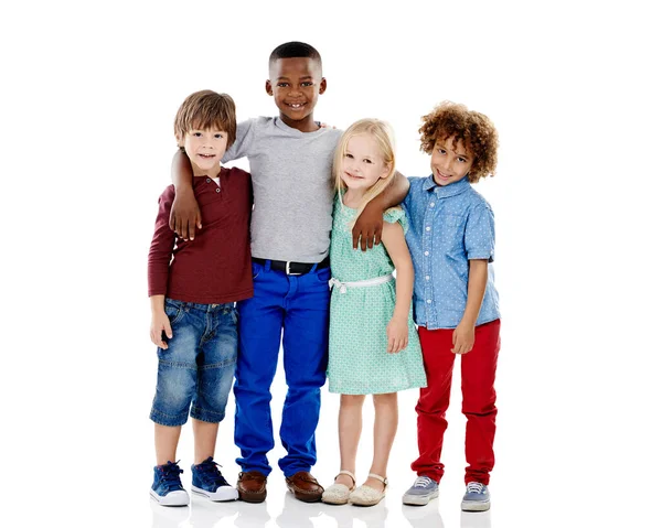 Embracing diversity. Studio shot of a group of young friends standing together against a white background. — Stock Photo, Image