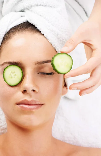 Beauty - the natural way. Cropped shot of a young woman getting a beauty treatment isolated on white. — Stock Photo, Image