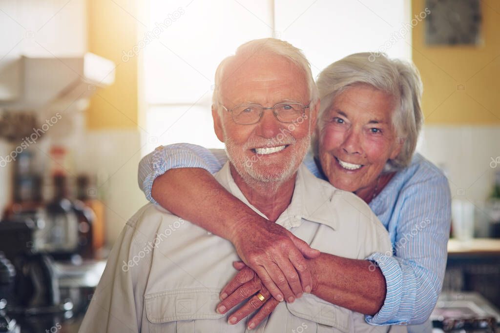 Golden years make for golden love. Portrait of a happy senior couple spending time together at home.