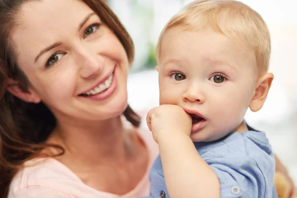 Hes become my whole world. Portrait of a mother spending quality time with her baby boy at home. — Stock Photo, Image