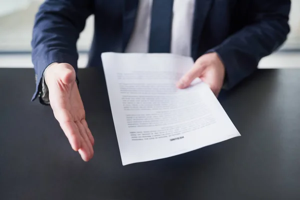 Su hoja de vida es impecable. Recortado disparo de un hombre de negocios sosteniendo un curriculum vitae y extendiendo su brazo para estrechar la mano. — Foto de Stock