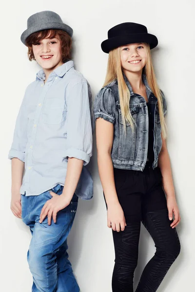 Cool kids. Portrait of two fashionable young kids posing in the studio. — Stock Photo, Image