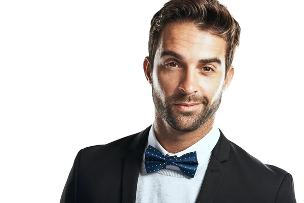 Killer good looks. Studio shot of a handsome young man wearing a tuxedo against a white background. — Stock Photo, Image