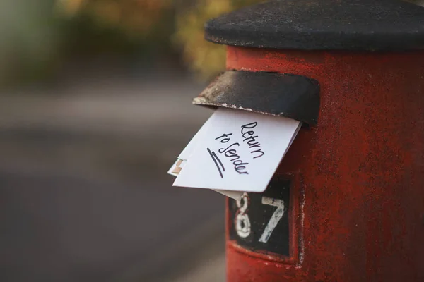 Undeliverable - return to sender. Cropped shot of letters in a letter box. — Stock Photo, Image