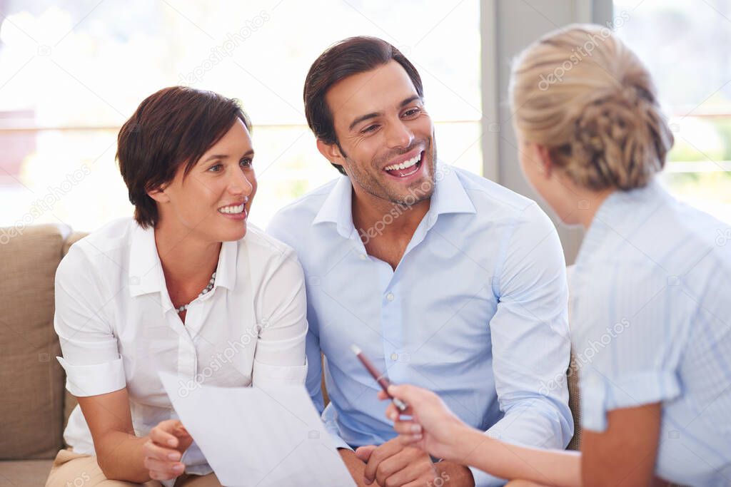 Making smart investment choices. Shot of a financial advisor explaining documents to a couple.