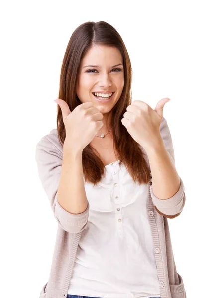 I give it two thumbs up. Studio shot of positive young woman showing thumbs up against a white background. — Stock Photo, Image