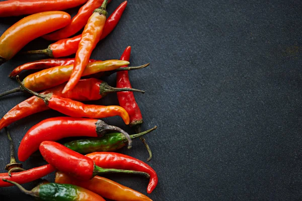 The hotter, the better. High angle shot of fresh red chillies on a kitchen counter. — Stock Photo, Image