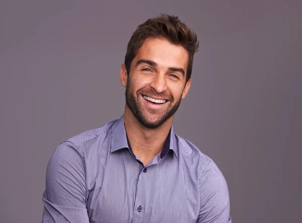 Rugged and manly. Studio shot of a handsome man against a gray background. — Stock Photo, Image
