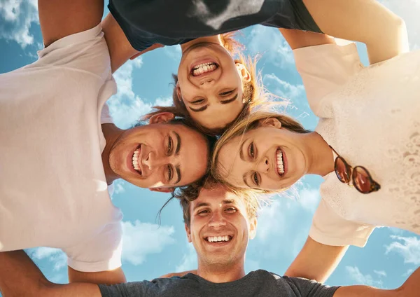 Our small circle of supportive friends. Low angle shot of a group of young friends huddled together in solidarity. — Stock Photo, Image