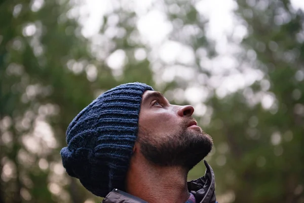 Beauty in nature to inspire the soul. Cropped shot of a handsome young male hiker in a forest. — Stock Photo, Image