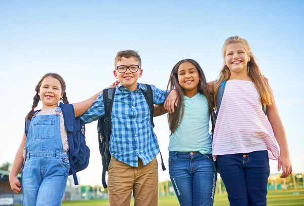 Friends make everything fun. Shot of a group of elementary school children together. — Stock Photo, Image