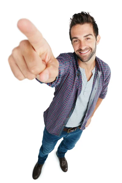 It doesnt get any bigger than this. Studio shot of a young man pointing against a white background. — Stock Photo, Image