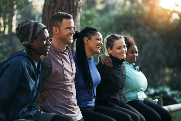 Working out in nature today. Cropped shot of a sporty young group of friends working out in the forest. — Stock Photo, Image