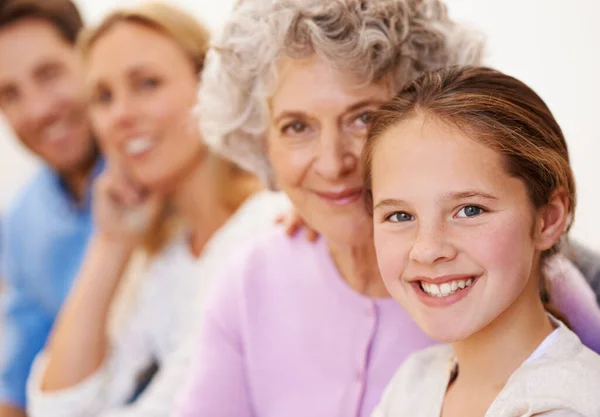 Quality time together. Portrait of a cheerful multi generational family smiling together. — Stock Photo, Image
