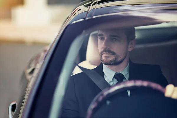 His car says a lot about him. Cropped shot of a businessman on his morning commute to work. — Stock Photo, Image