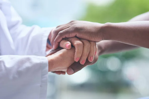Working together is how well get through this. Shot of unrecognizable people holding hands. — Stock Photo, Image