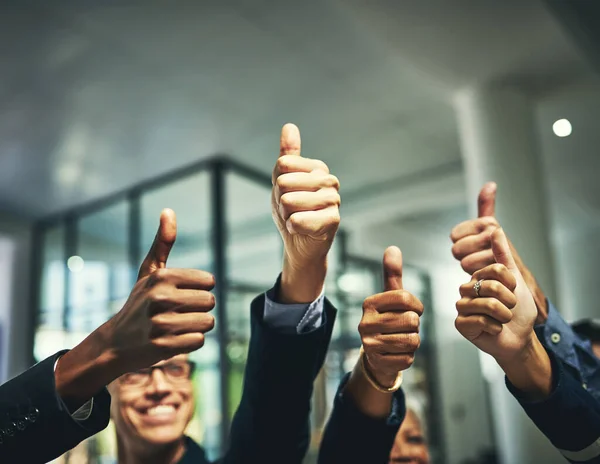 We like it a lot. Closeup shot of a group of unrecognizable businesspeople showing thumbs up in an office. — Stock Photo, Image